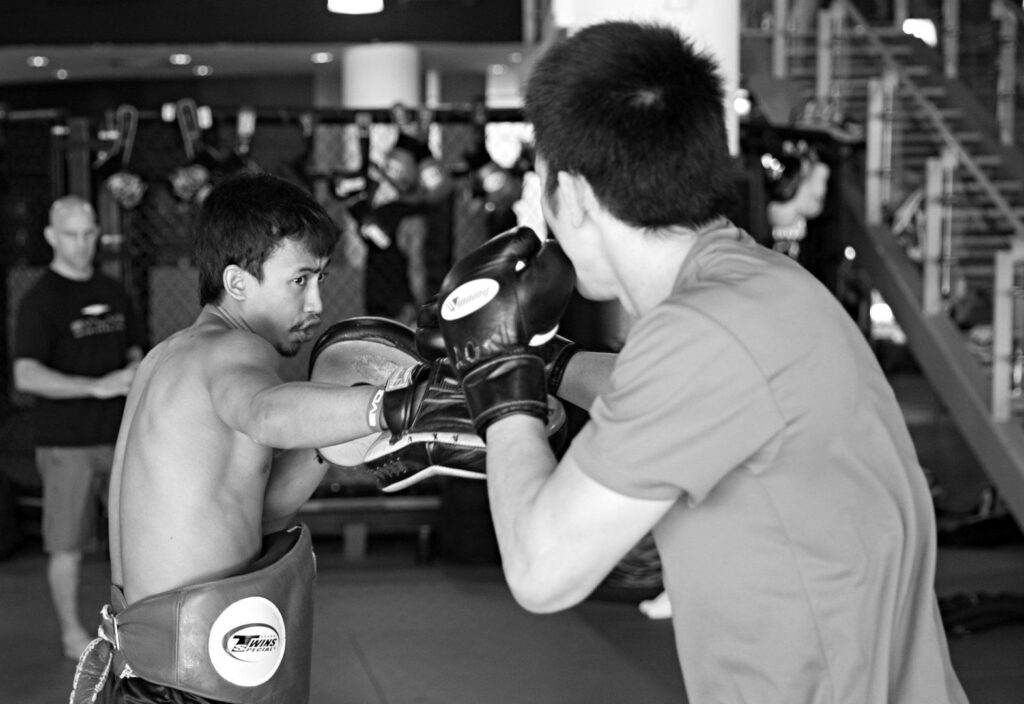 Multiple-time Muay Thai World Champion Penek Sitnumnoi helps ONE Lightweight World Champion Shinya Aoki with his striking.
