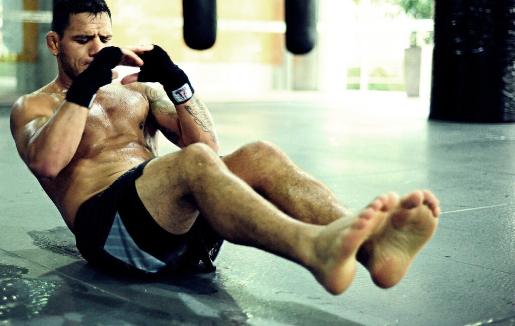 UFC Lightweight World Champion and BJJ World Champion Rafael Dos Anjos works on strengthening his core after a training session with the Evolve Fight Team.