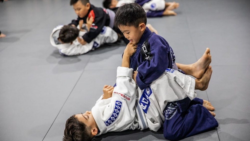 Two young students drilling in the little samurai's class at Evolve MMA.