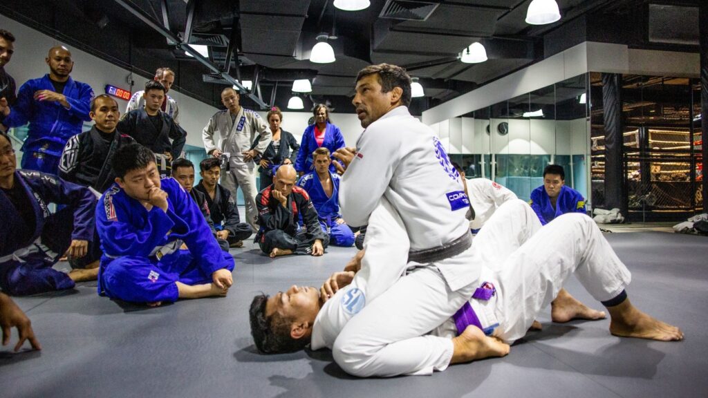 Teco Shinzato teaching a BJJ technique in class