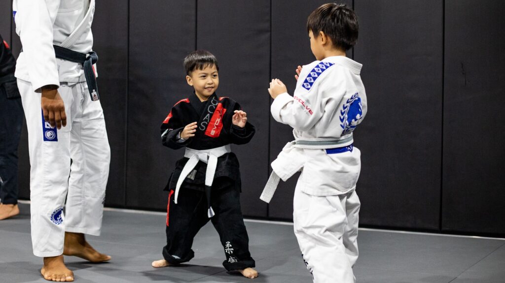 two kids training martial arts