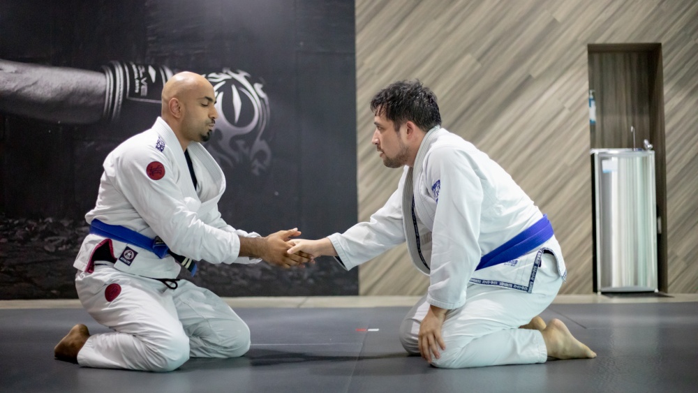 bjj students shaking hands in gi