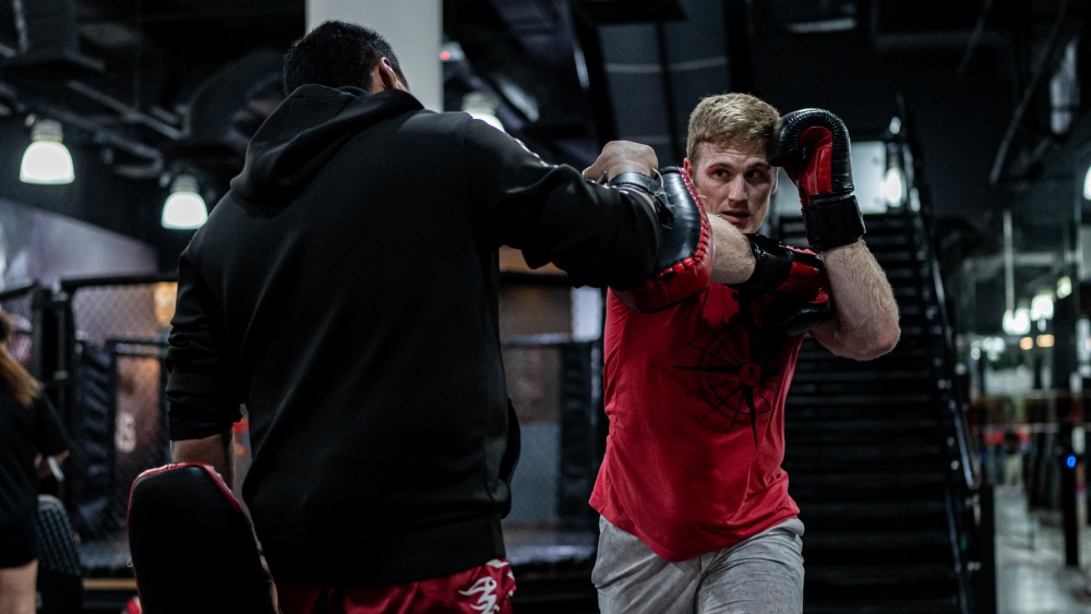 How to Hold Focus Pads for a Right Hook to the Body (13 of 32), Boxing