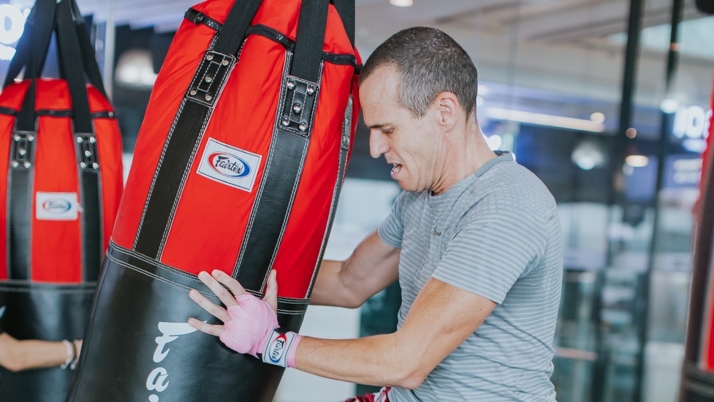 Muay thai student heavy bag