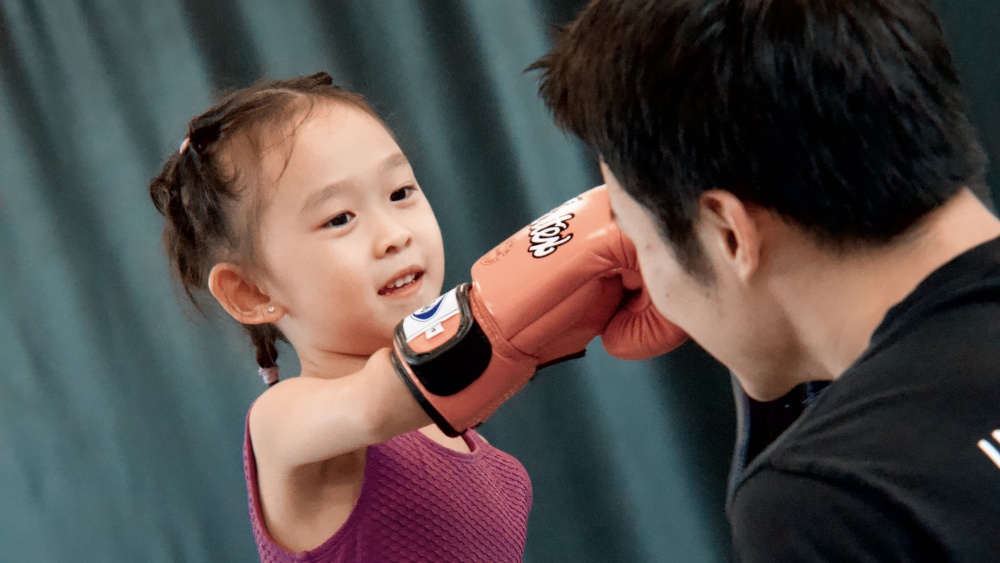 A young student enjoying her lesson at the Evolve Children's program.